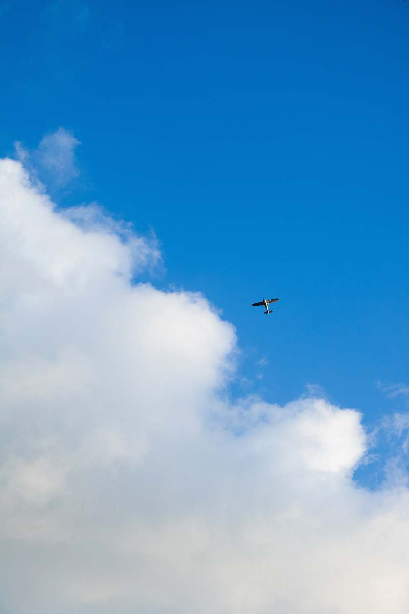 leisure activities gray aireplance on sky during daytime gliding